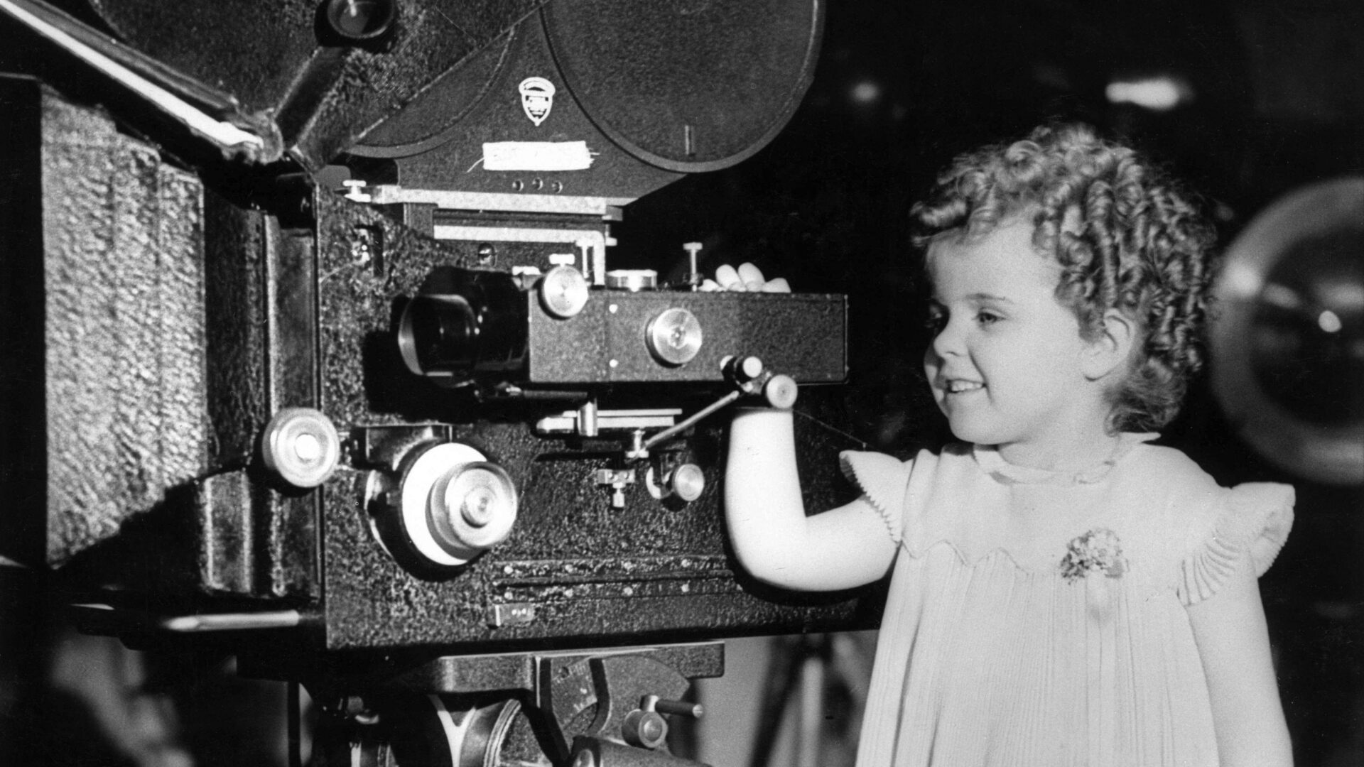 Small child apparently operating cinema equipment (Brent Cross Town)
