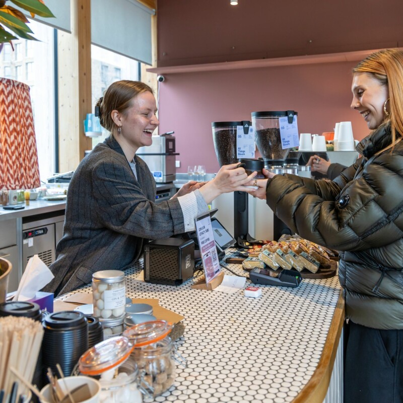 Photo of a barista serving coffee to a customer in Arthur's Coffee House, Brent Cross Town. (Brent Cross Town)