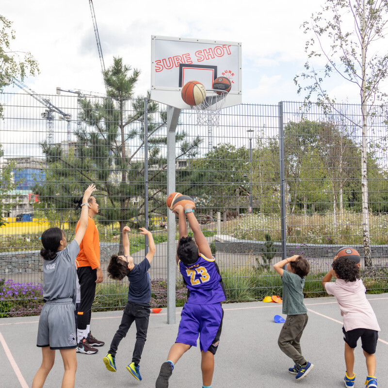 Young people enjoying Brent Bulls Basketball training, part of the Summer Program at Brent Cross Town