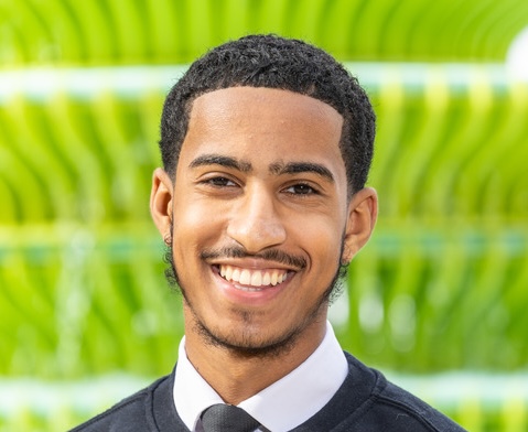 Photo of Abdullah Ally against a green background. (Brent Cross Town)