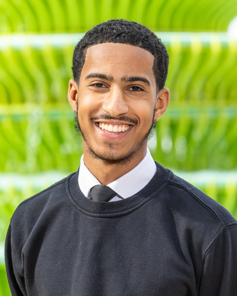 Photo of Abdullah Ally with a green background. (Brent Cross Town)