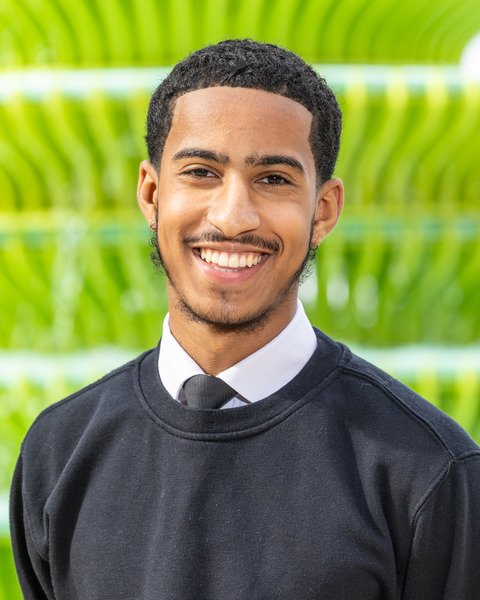 Photo of Abdullah Ally with a green background. (Brent Cross Town)