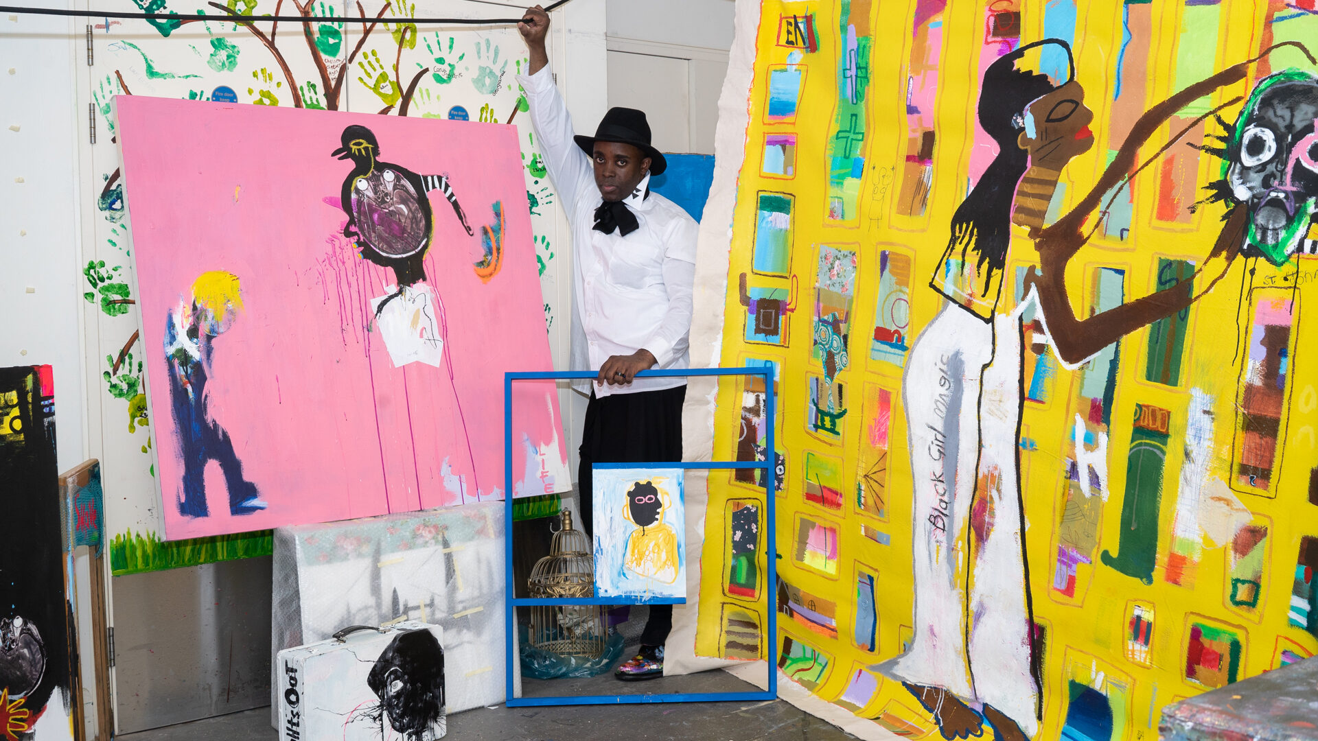 Artist in studio with large-scale canvases (Brent Cross Town)