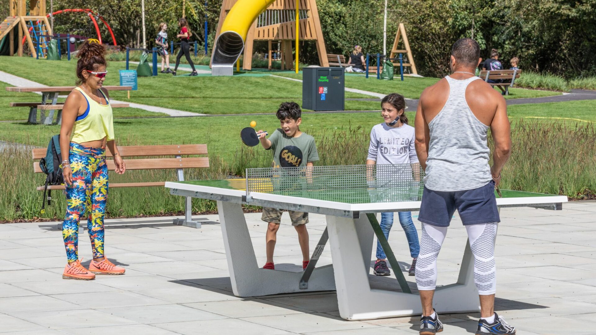 People playing table tennis in Exploratory Park (Brent Cross Town)