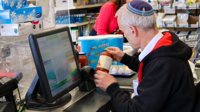 Photo of a cashier at the Kosher Outlet, Brent Cross Town. (Brent Cross Town)
