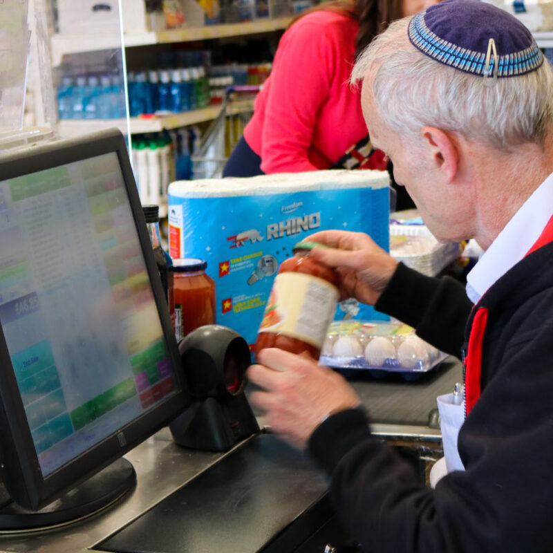 Photo of a cashier at the Kosher Outlet, Brent Cross Town. (Brent Cross Town)