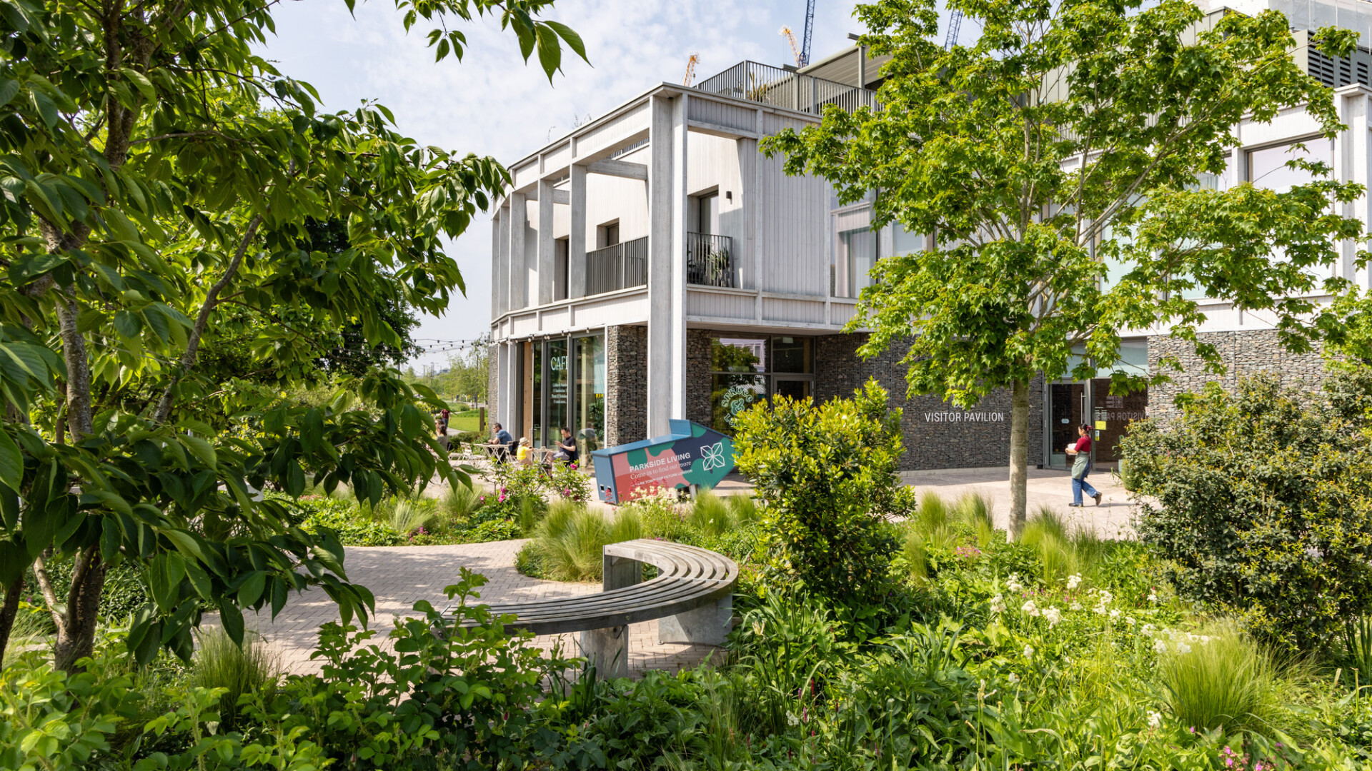 CGI of Brent Cross Town Visitor Pavilion behind leafy trees. (Brent Cross Town)
