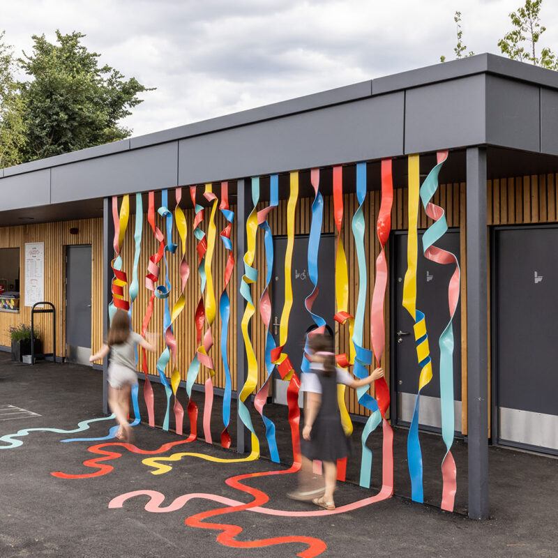 Photo of the colourful Rainbow of Ribbons installation by Hanna Benihoud at Claremont Park, Brent Cross Town. (Brent Cross Town)
