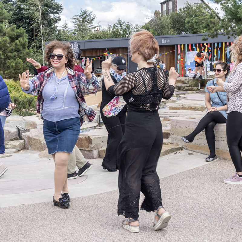Women dancing in Claremont Park Brent Cross Town (Brent Cross Town)
