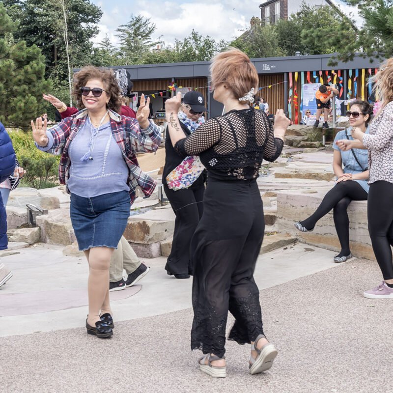Women dancing in Claremont Park Brent Cross Town (Brent Cross Town)