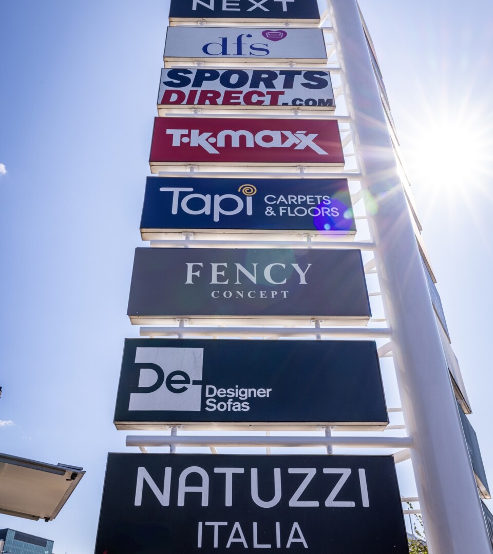 Photo of the board at Brent South Shopping Park showing many of the shops there, including Next, DFS, Sports Direct, TKMaxx, Tapi, Fency, Designer Sofas, and Natuzzi. (Brent Cross Town)
