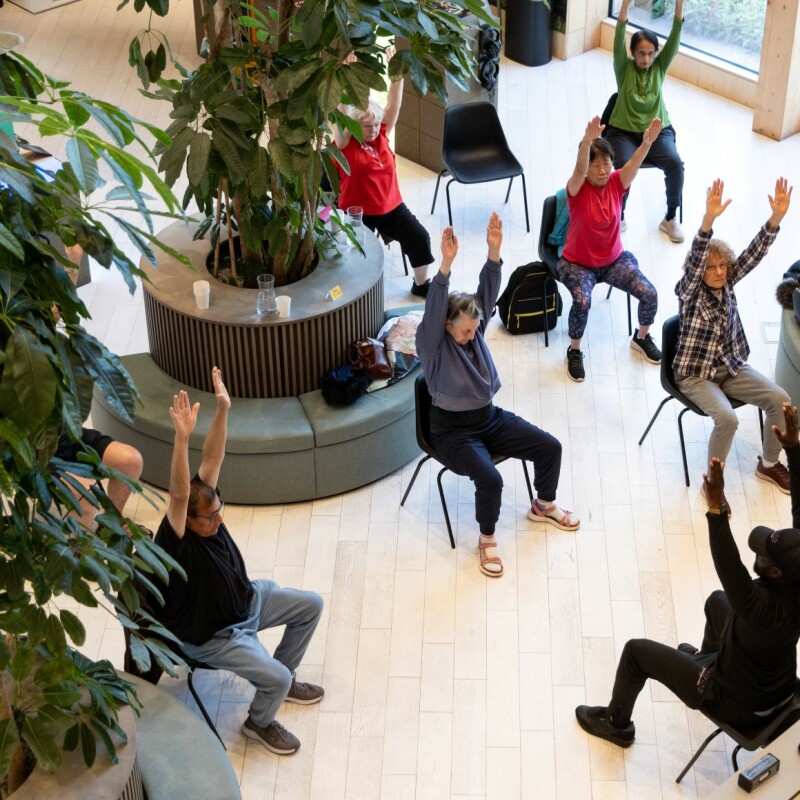 Birds-eye-view photo of people doing a chair exercise class in Brent Cross Town. (Brent Cross Town)