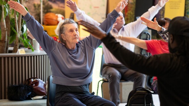 Photo of people doing chair exercises in Brent Cross Town. (Brent Cross Town)