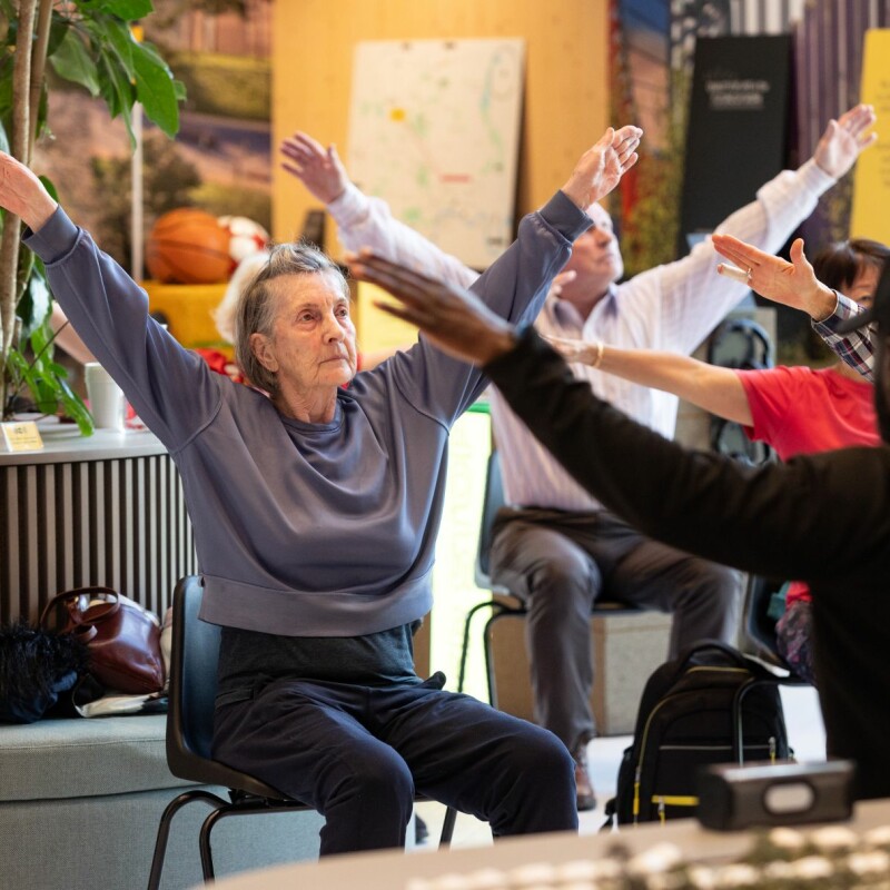 Photo of people doing chair exercises in Brent Cross Town. (Brent Cross Town)