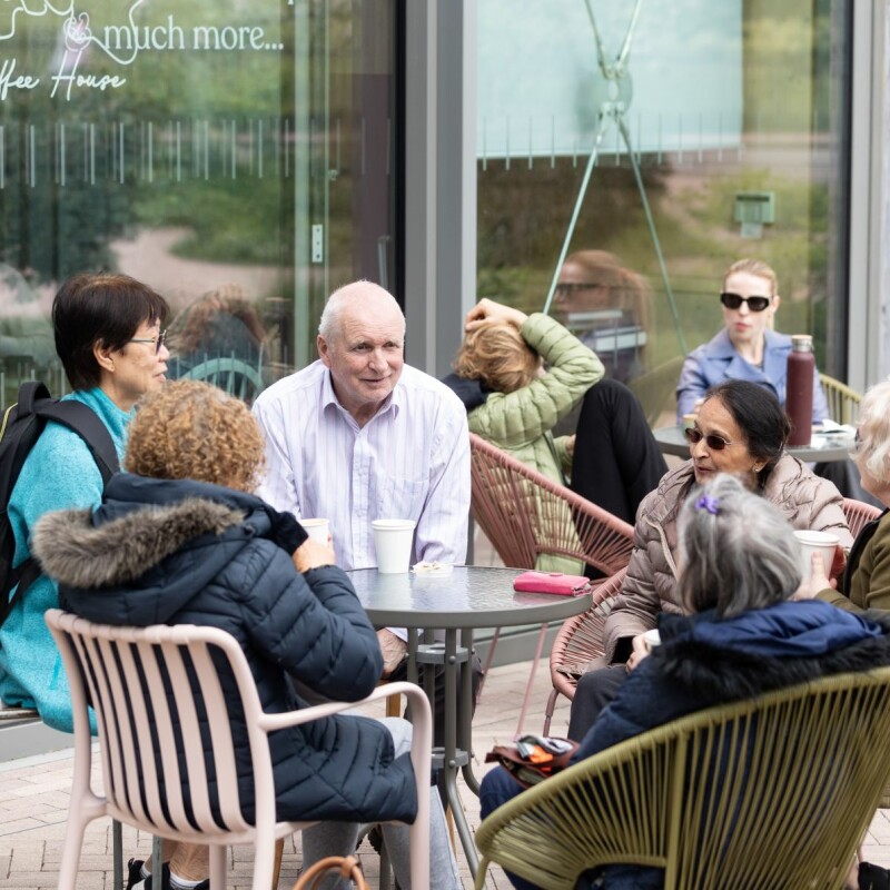 Photo of people happily chatting outside after the Brent Cross Town chair exercise class. (Brent Cross Town)