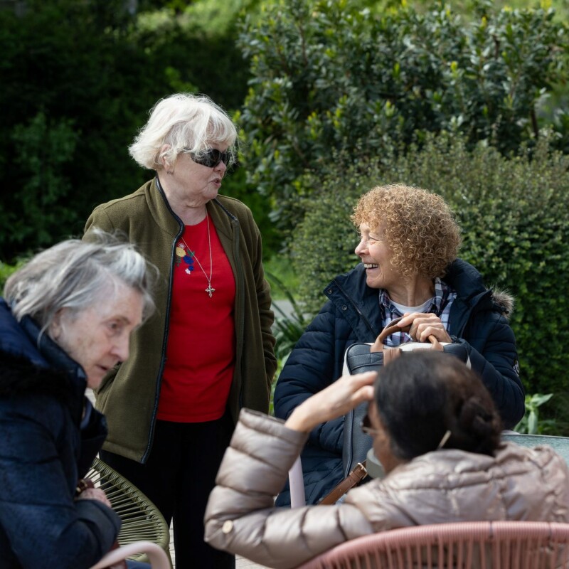 Photo of people happily chatting outside after the Brent Cross Town chair exercise class. (Brent Cross Town)