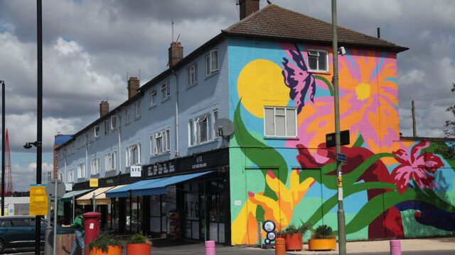 Photo of AFG Food and Wine on Claremont Terrace, with a colourful mural on the wall. (Brent Cross Town)