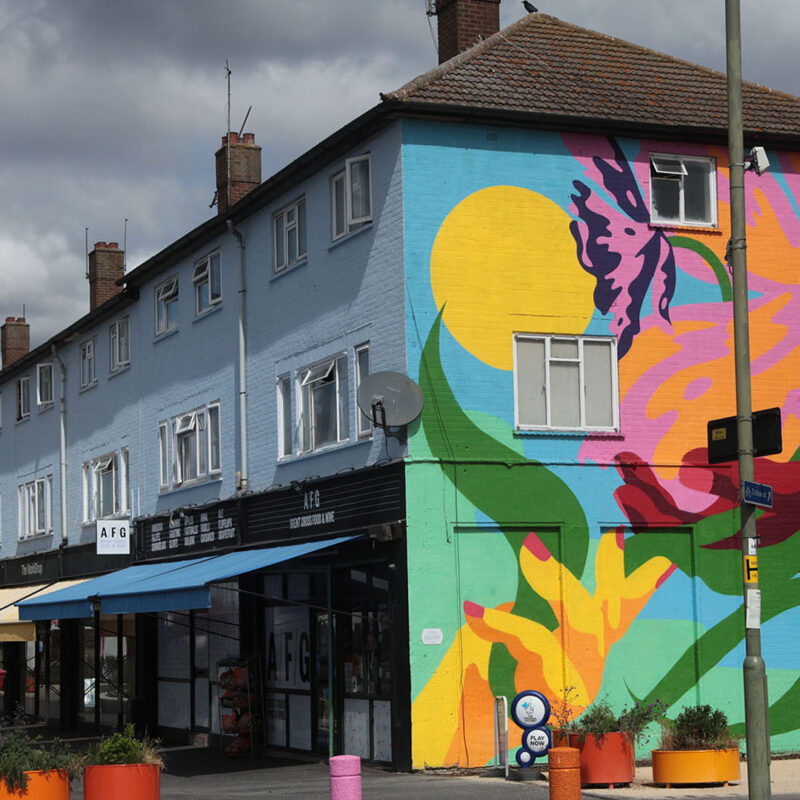 Photo of AFG Food and Wine on Claremont Terrace, with a colourful mural on the wall. (Brent Cross Town)