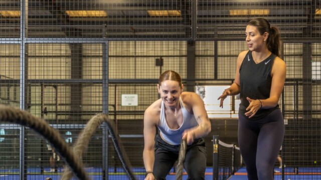 Photo of Serena the fitness instructor supporting someone using ropes at a bootcamp session. (Brent Cross Town)