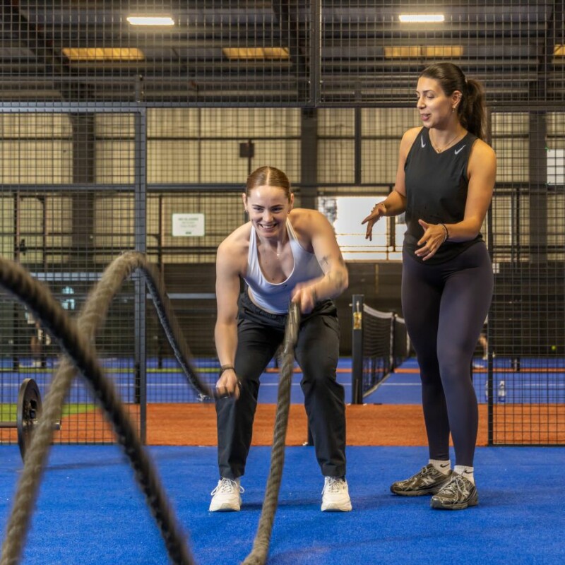 Photo of Serena the fitness instructor supporting someone using ropes at a bootcamp session. (Brent Cross Town)