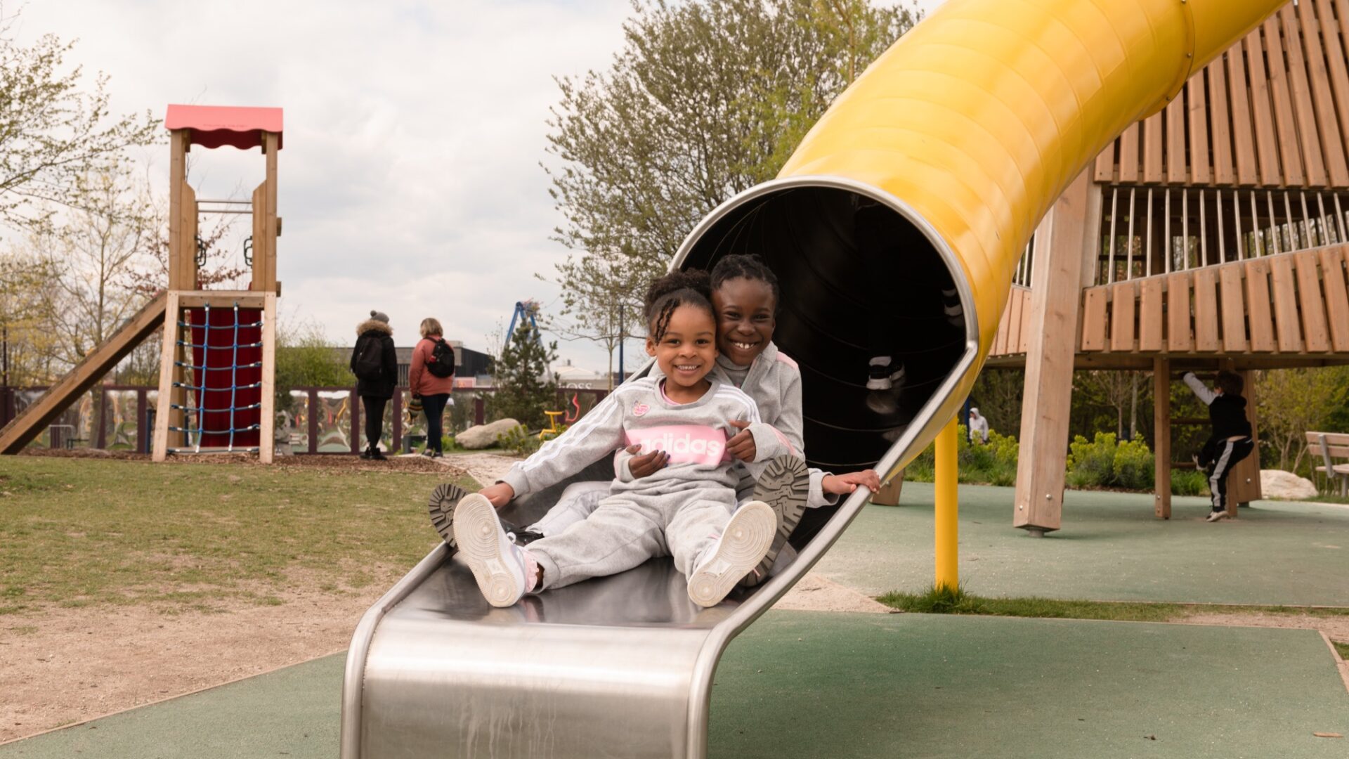 Children sliding down slide (Brent Cross Town)