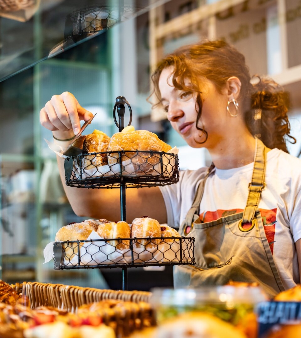 Photo of a woman working at Karma Bread Bakehouse in Brent Cross Town. (Brent Cross Town)