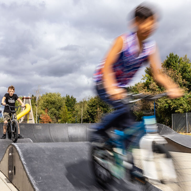 Kids riding on the pump track in Explotory Park, Brent Cross Town (Brent Cross Town)