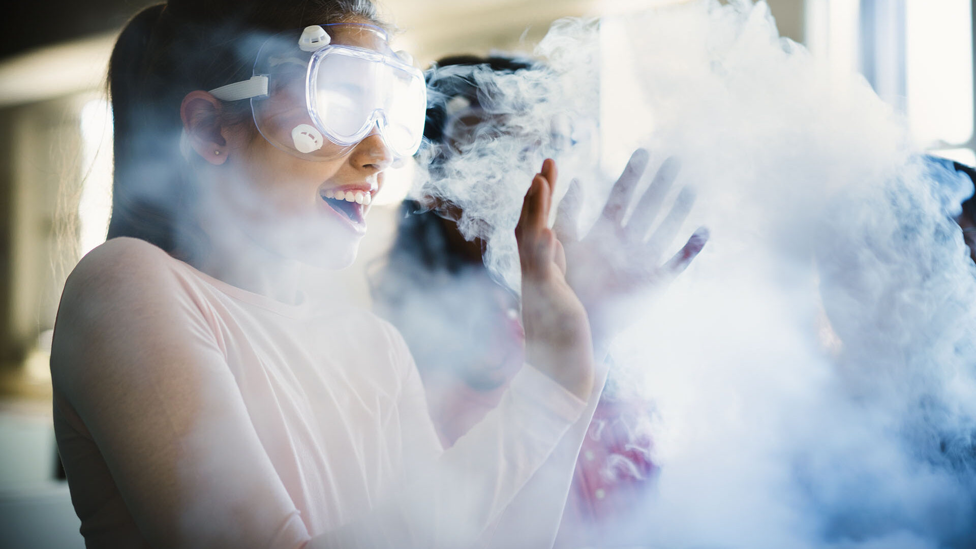 a pupil thrilled by the smoke coming off her science project (Brent Cross Town)