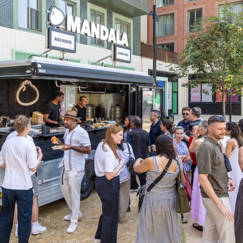 Photo of a crowd of people by a street food van in Neighbourhood Square in Brent Cross Town. (Brent Cross Town)