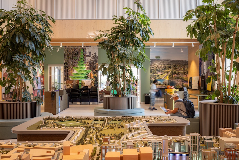Photo of the inside of the Brent Cross Town Pavilion, with a miniature scale model of the town on display. (Brent Cross Town)